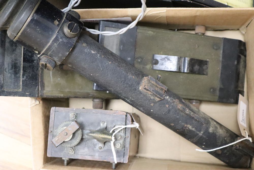 A collection of vintage military equipment, including a WWII British Tank Telescope Sight No. 33 MK III,